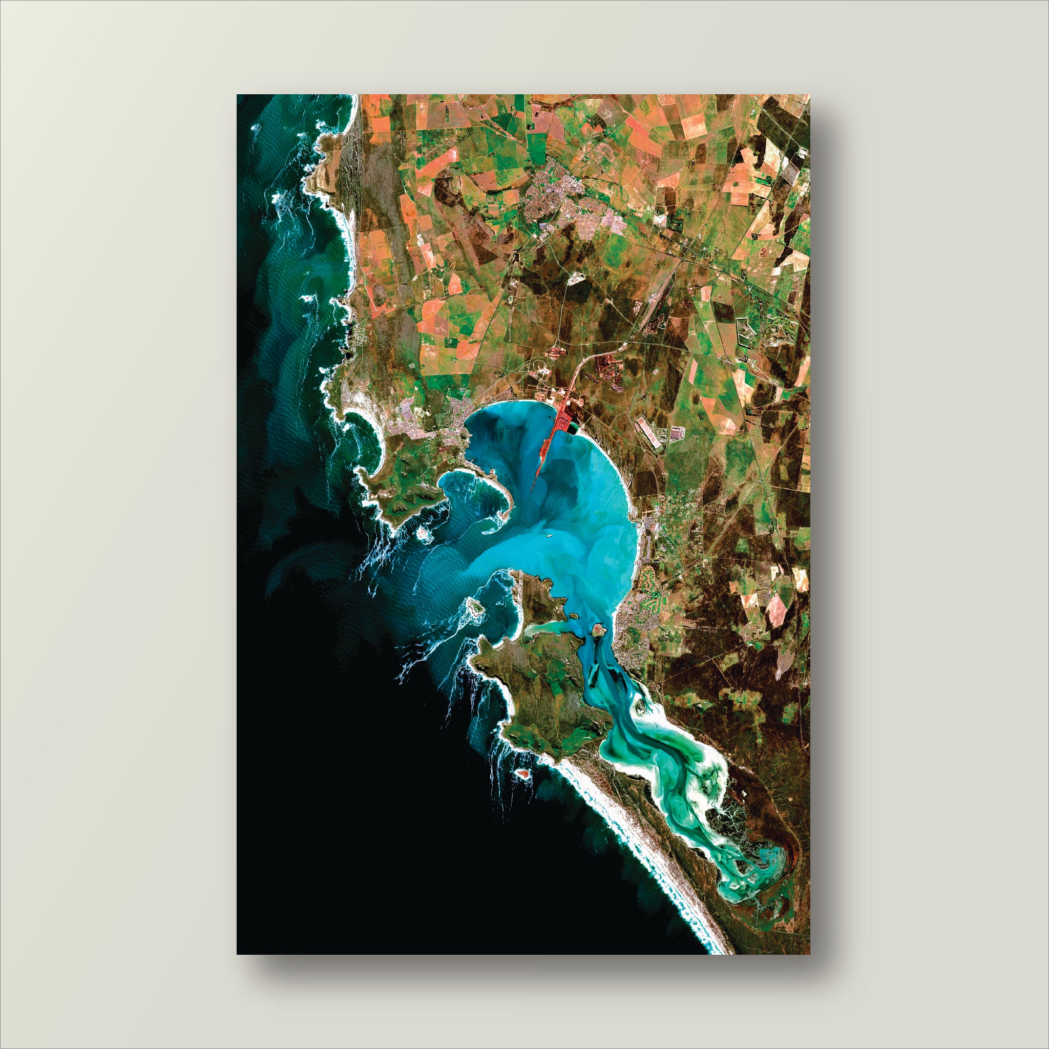 Satellite image of west coast peninsula with green and blue colors on a gray background