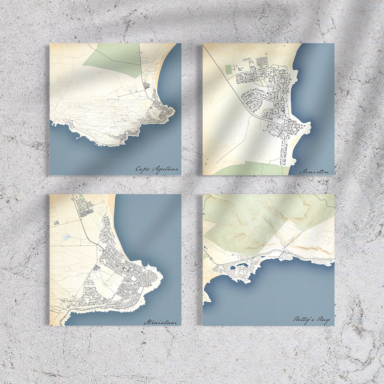 Gallery of Struisbaai, Arniston, Cape Agulhas, Betty's Bay map prints in Classic style on grey cement wall.