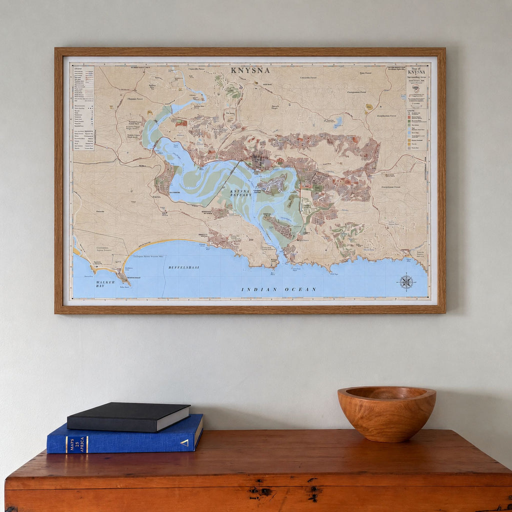 Knysna large map print in the Vintage style, in a warm oak frame with a white mount, hung above a wooden chest