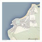 Kommetjie map print in the Classic style, with fine black street lines, grey buildings, the blue Atlantic, sandy Long Beach and green Slangkop slopes on a cream background