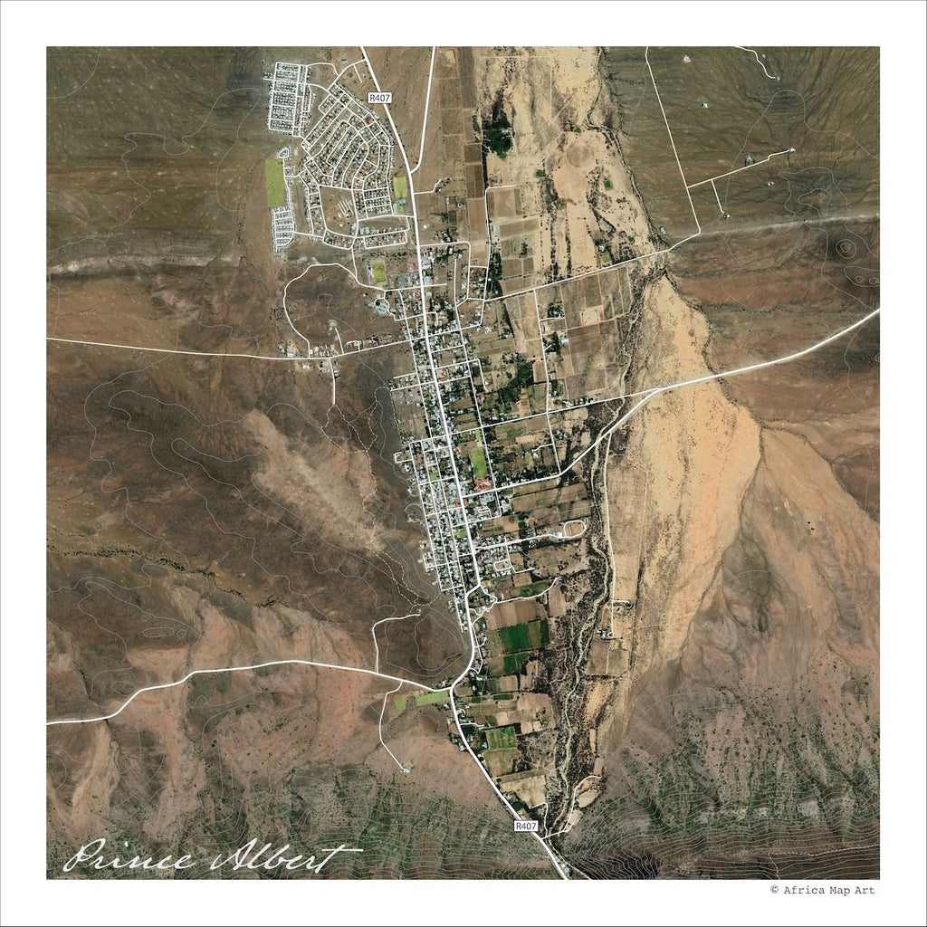 Prince Albert aerial map print showing satellite imagery of the village and its green irrigated plots, with white roads across the browns and tans of the Karoo landscape.