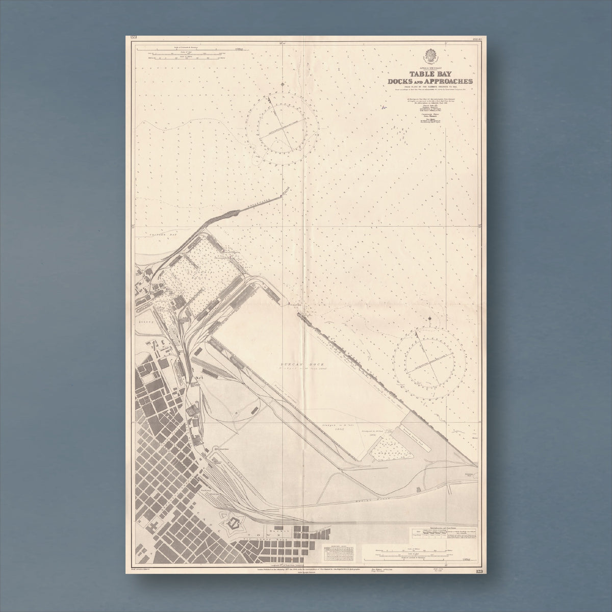 1943 Admiralty chart of the Table Bay Docks, reproduction print showing Cape Town's harbour basins, breakwater and city street grid, with two compass roses