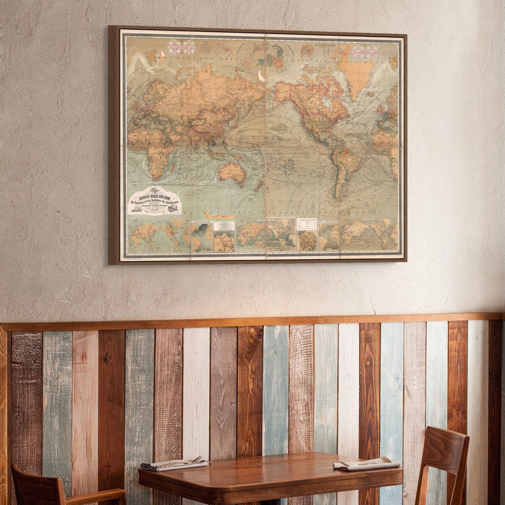 The 1870 Baur & Bromme world map framed on a wall above reclaimed wood panelling and a wooden table and chairs